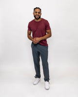 Male model in Trailhead grey pants and a contrasting red shirt